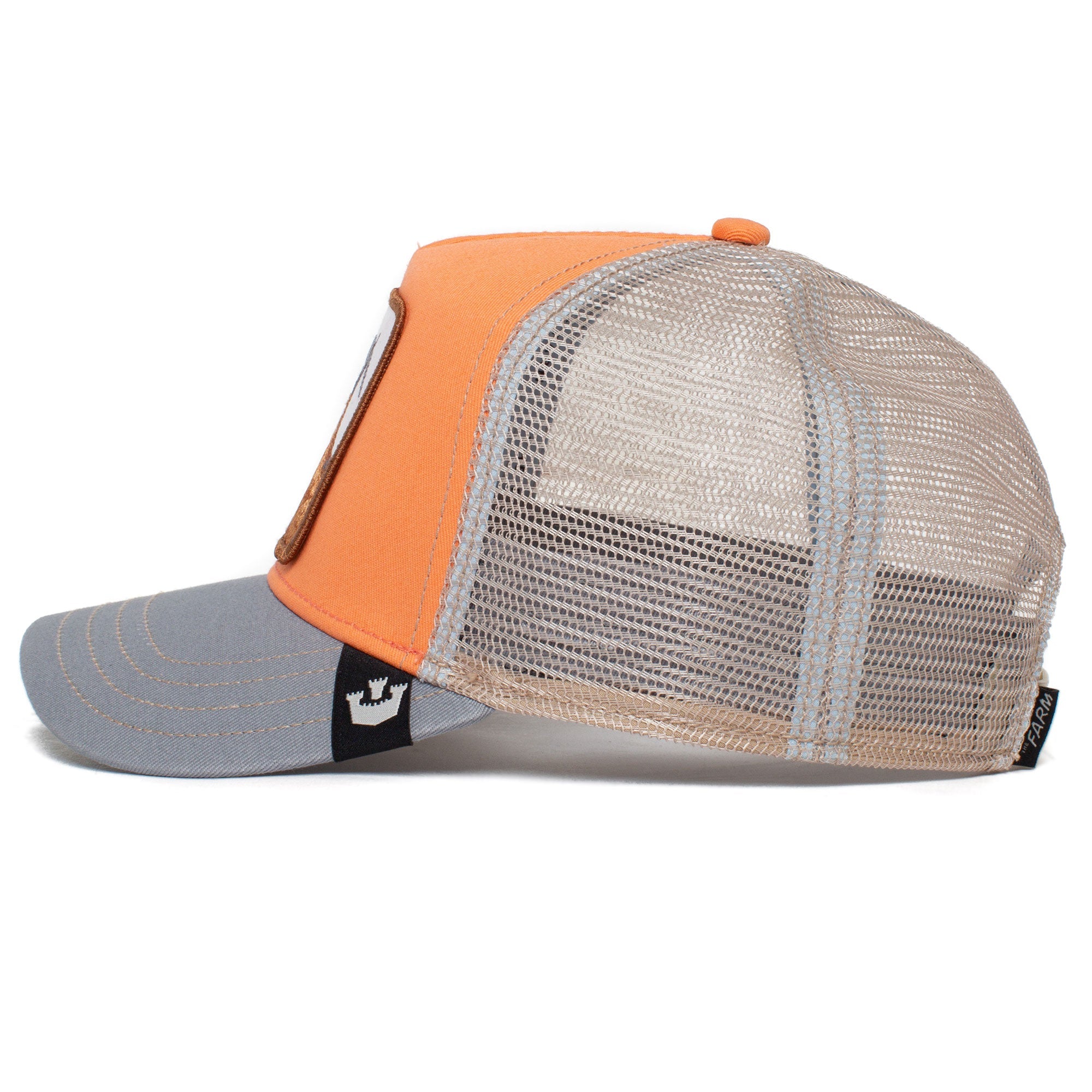 The GOAT is a striking orange and gray trucker hat with a mesh back panel, displayed side view. Its vibrant colors may gently fade over time, adding unique character to its classic style.