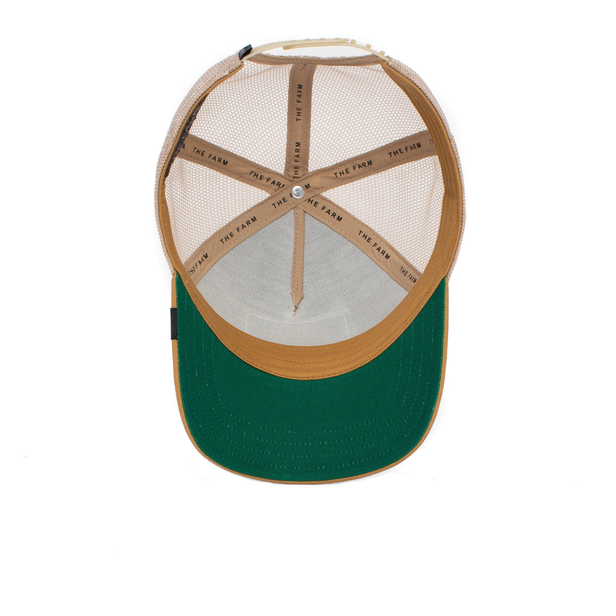 Inside view of The GOAT, a tan mesh trucker hat with green brim and THE FARM printed on the internal bands, crafted to endure and never fade.