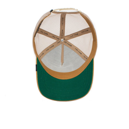 Inside view of The GOAT, a tan mesh trucker hat with green brim and THE FARM printed on the internal bands, crafted to endure and never fade.