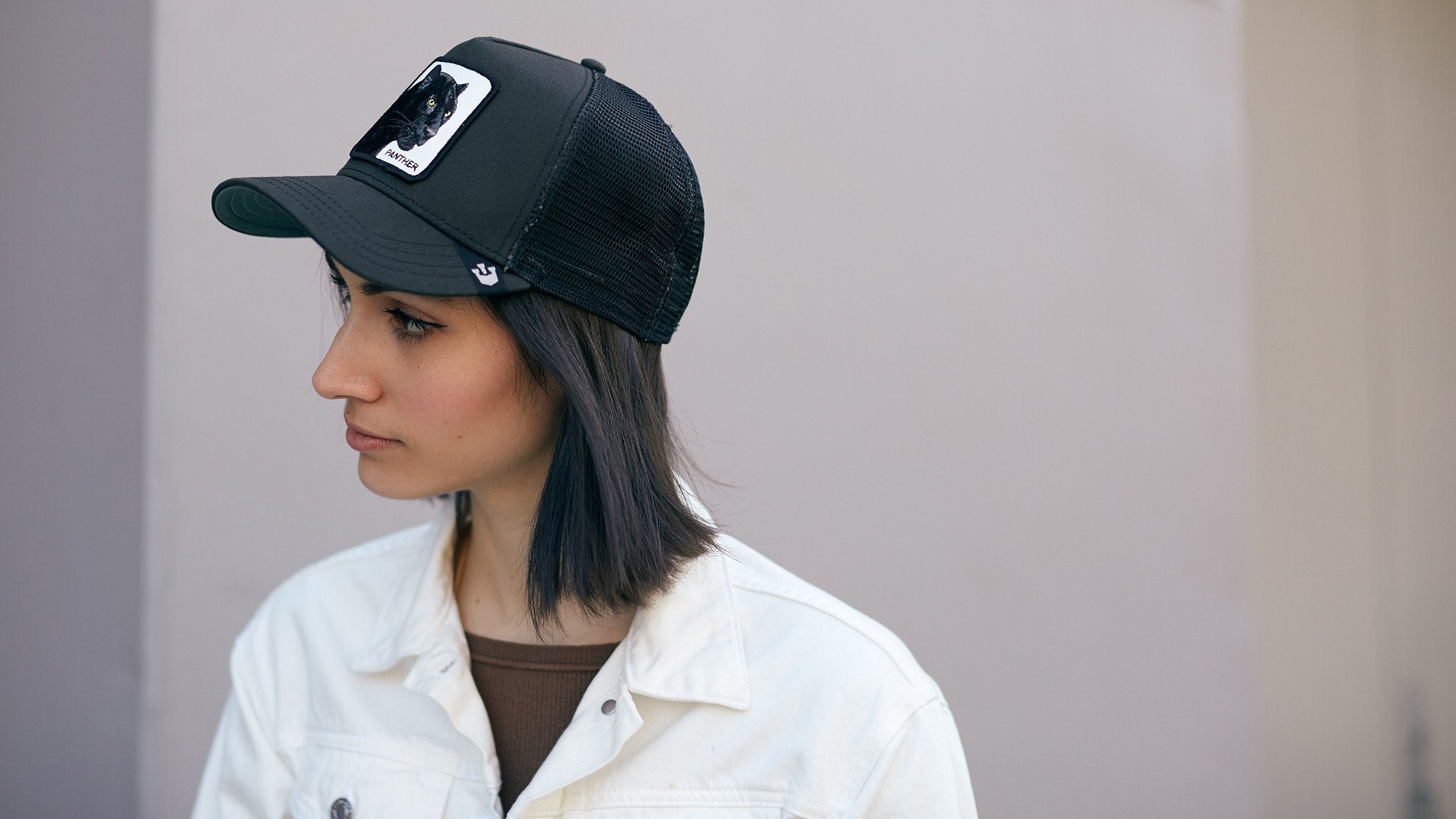 Goorin Bros. black panther cotton 5 panel trucker baseball cap Black hero shot on female model