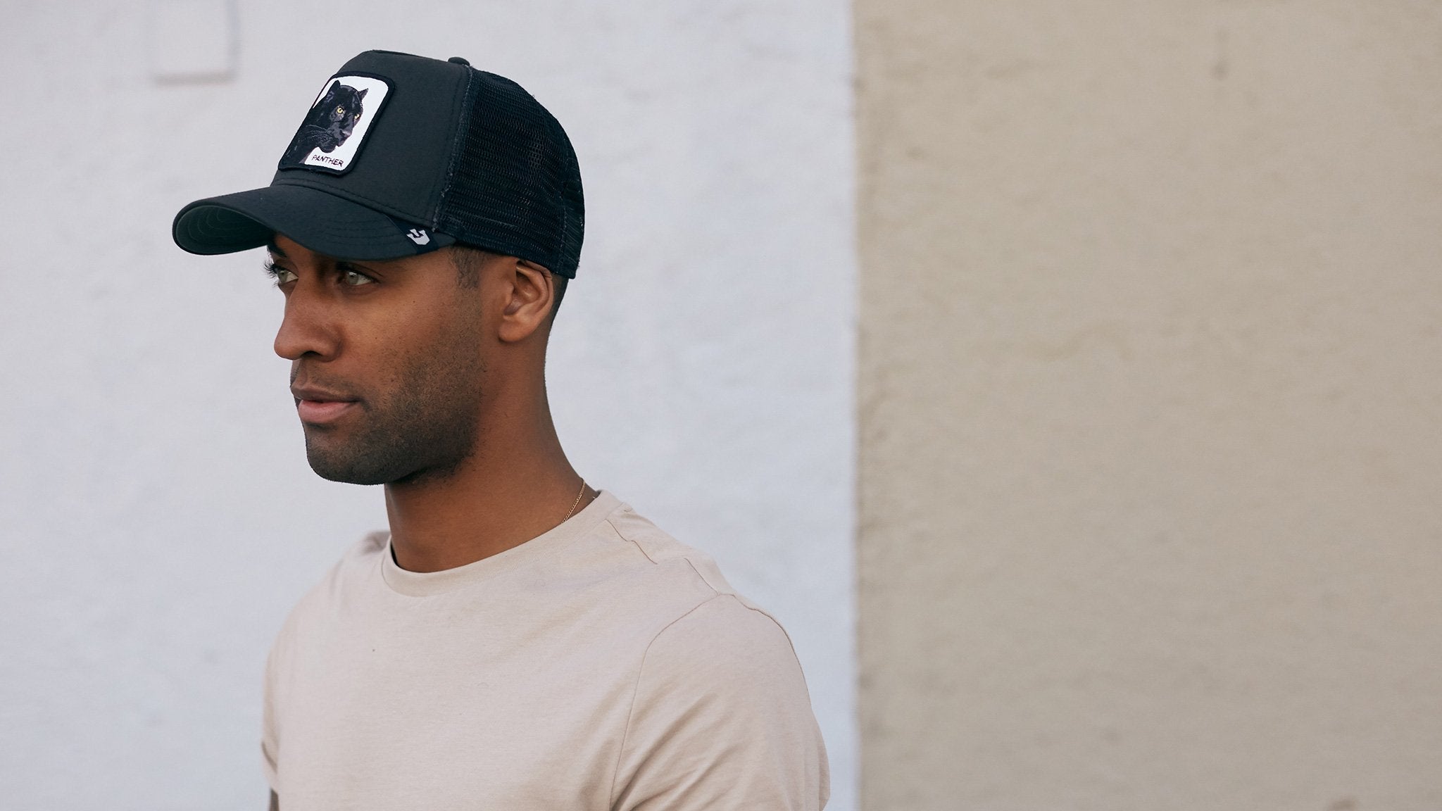 Goorin Bros. black panther cotton 5 panel trucker baseball cap Black hero shot on male model